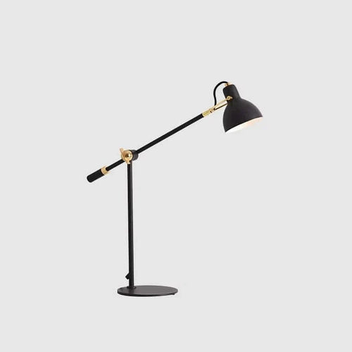 Adjustable arm black steel table lamp, on a plain background