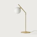 Adjustable arm opal glass globe lamp, in matte brass, front view