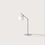 Adjustable arm opal glass globe lamp, in chrome, front view