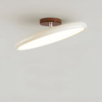 Tilting disc ceiling light, in beige, tilted