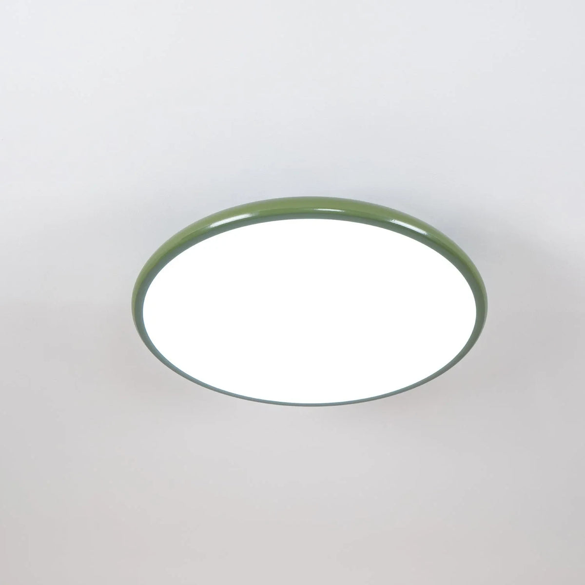 Tilting disc ceiling light, in green