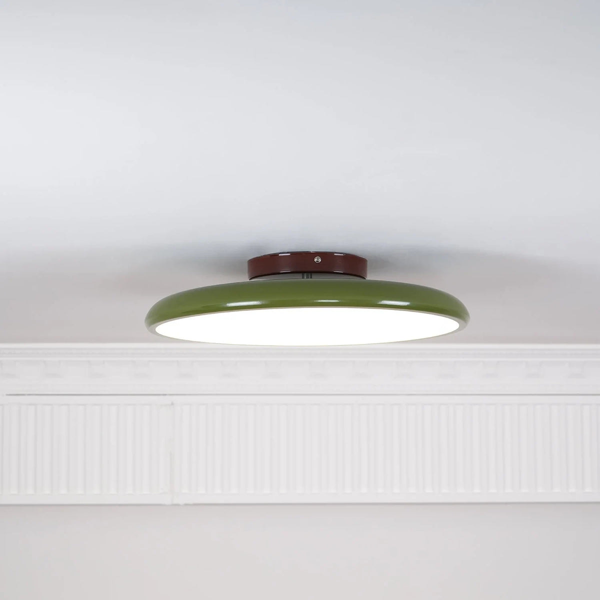 Tilting disc ceiling light, in green