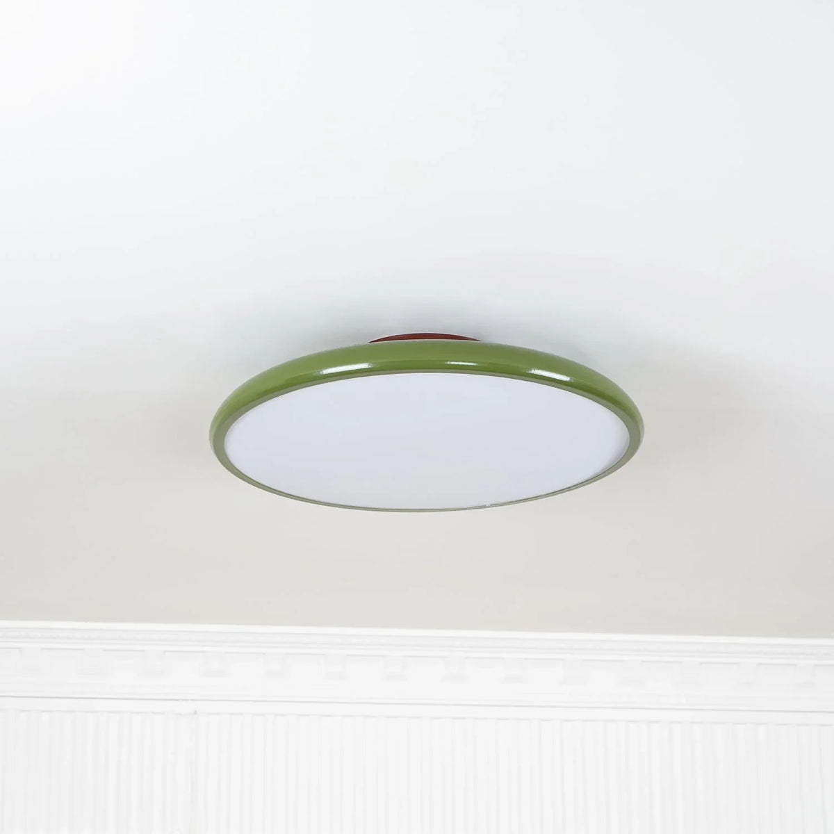 Tilting disc ceiling light, in green