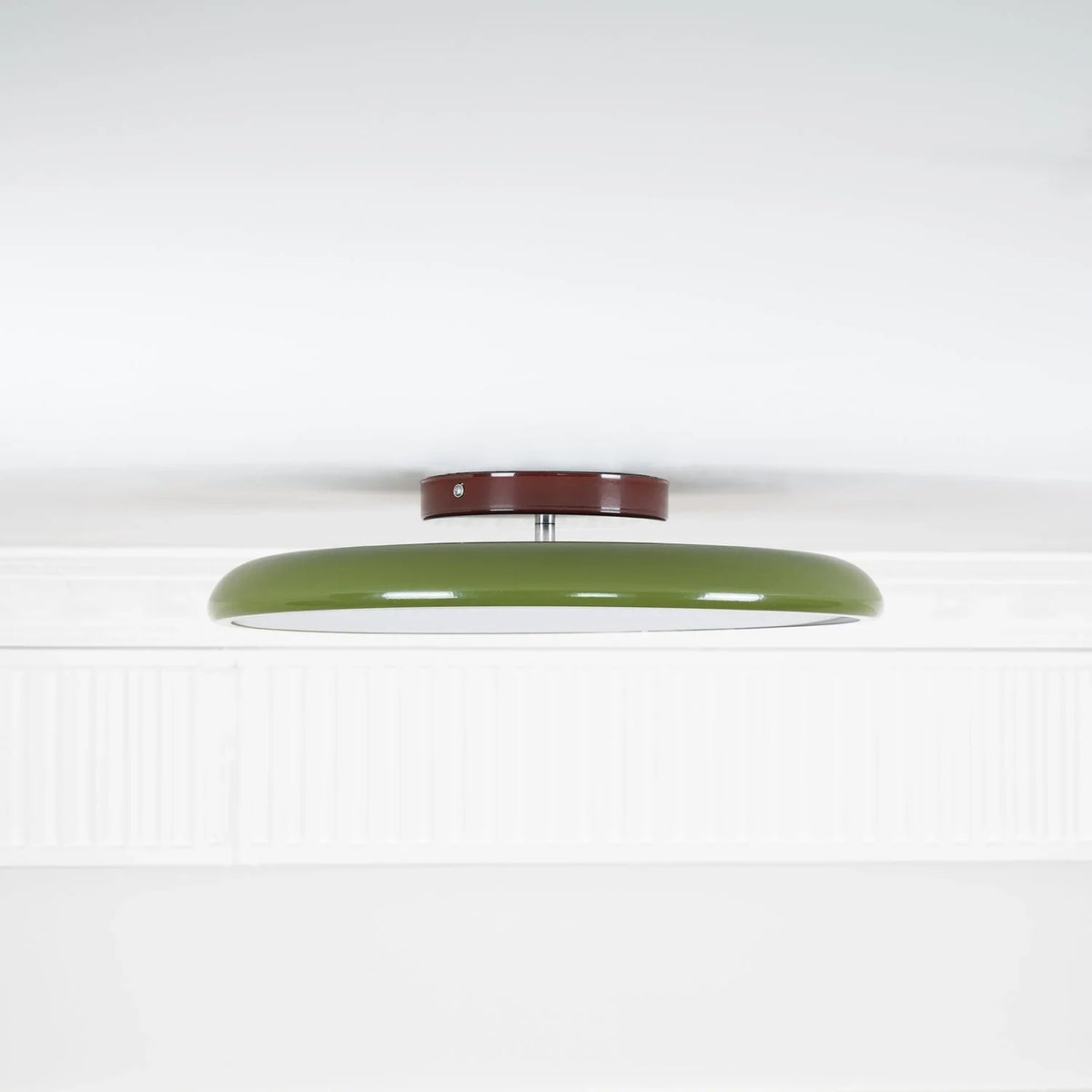 Tilting disc ceiling light, in green