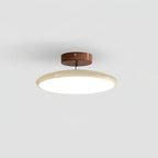 Tilting disc ceiling light, in beige