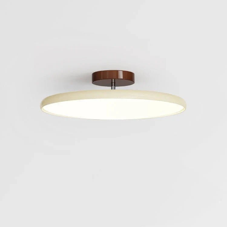 Tilting disc ceiling light, in beige