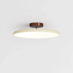 Tilting disc ceiling light, in beige
