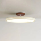 Tilting disc ceiling light, in beige