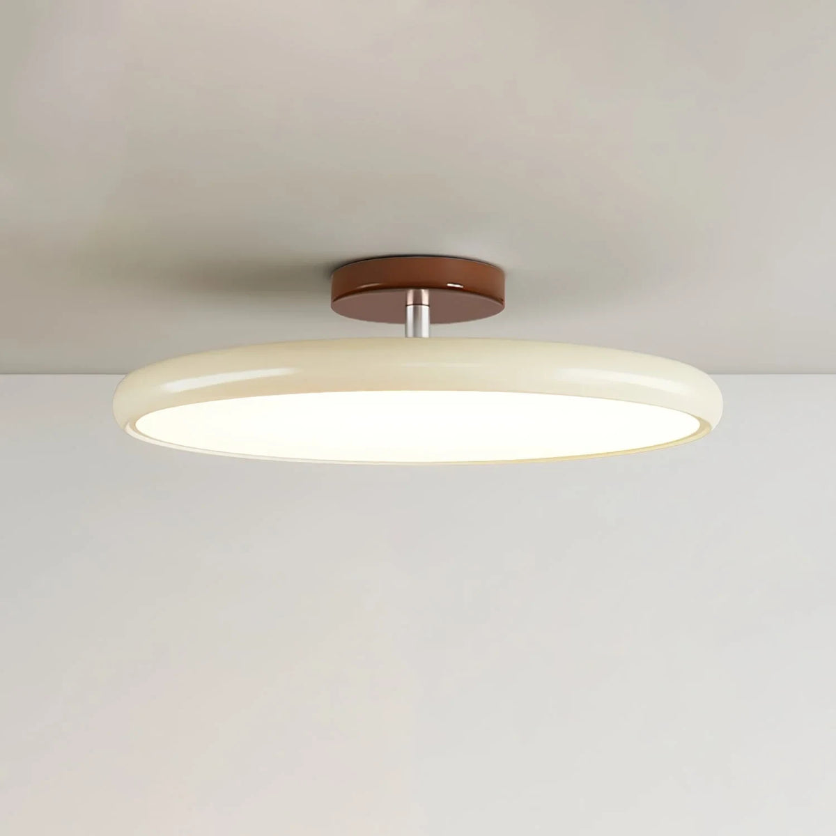 Tilting disc ceiling light, in beige