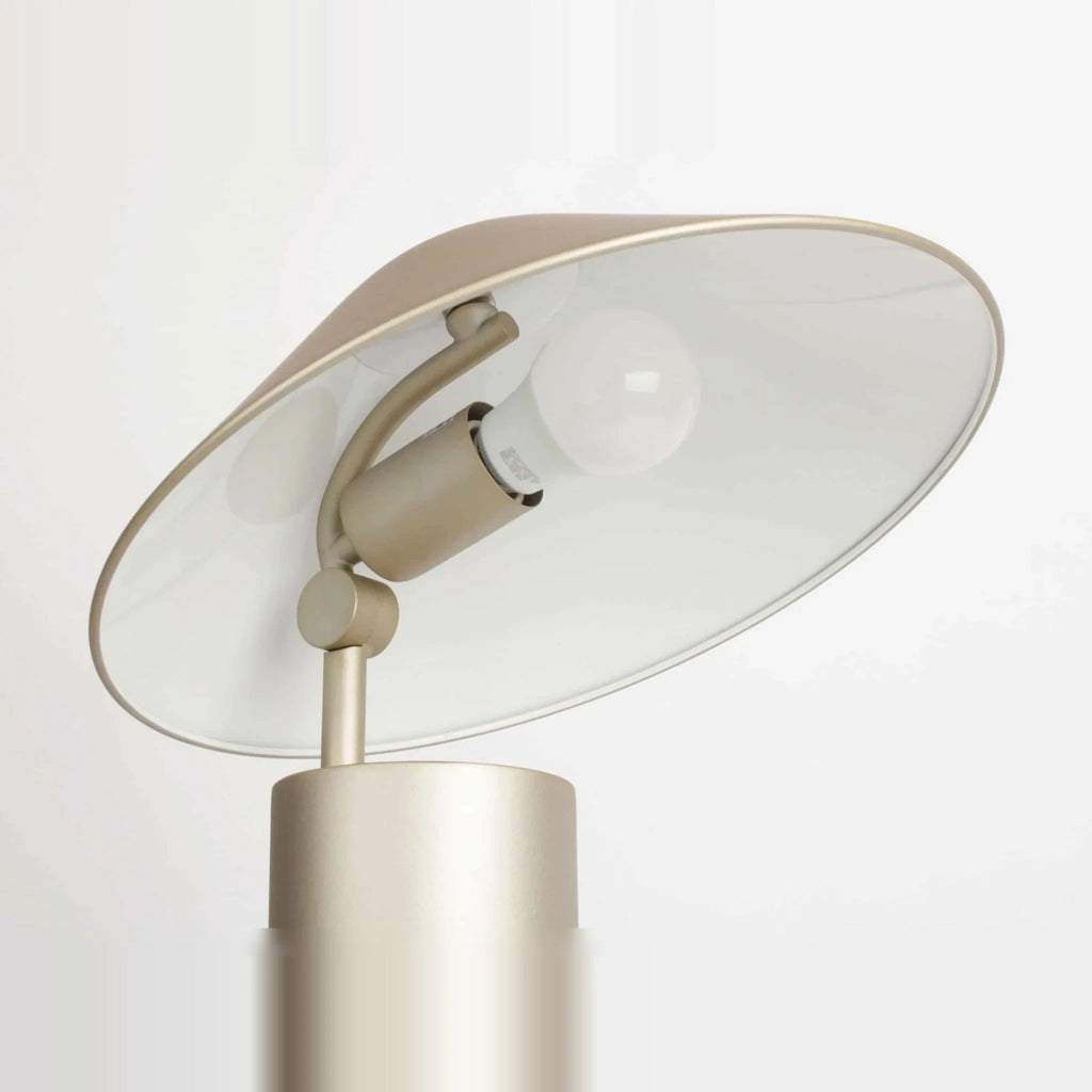 Adjustable cone shade steel table lamp, in Champagne Gold, underside of the shade and bulb