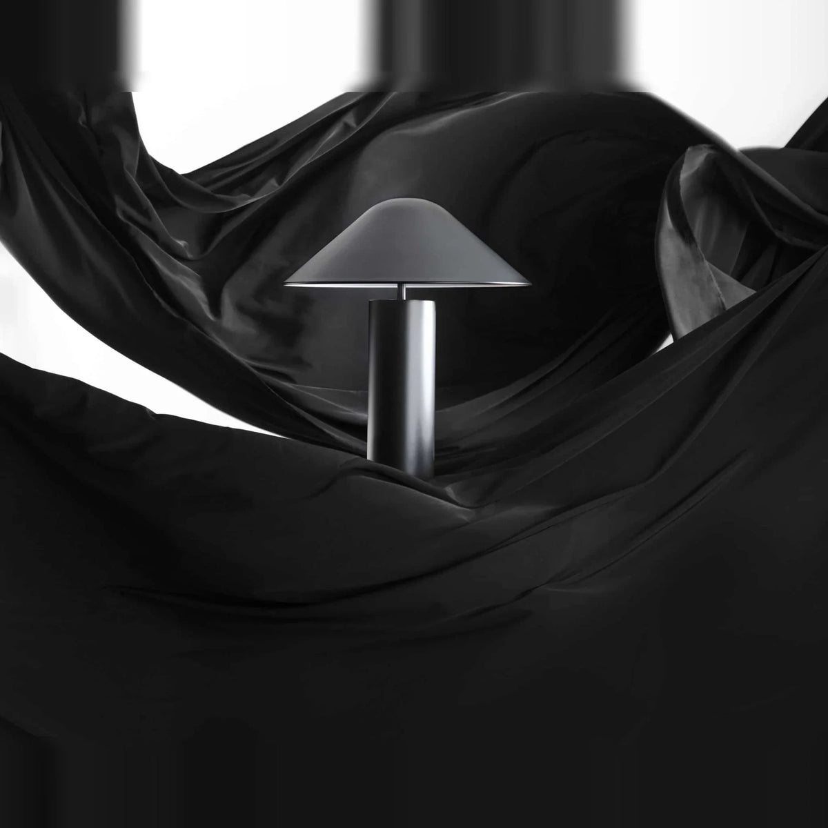 Adjustable cone shade steel table lamp, on a dark drape