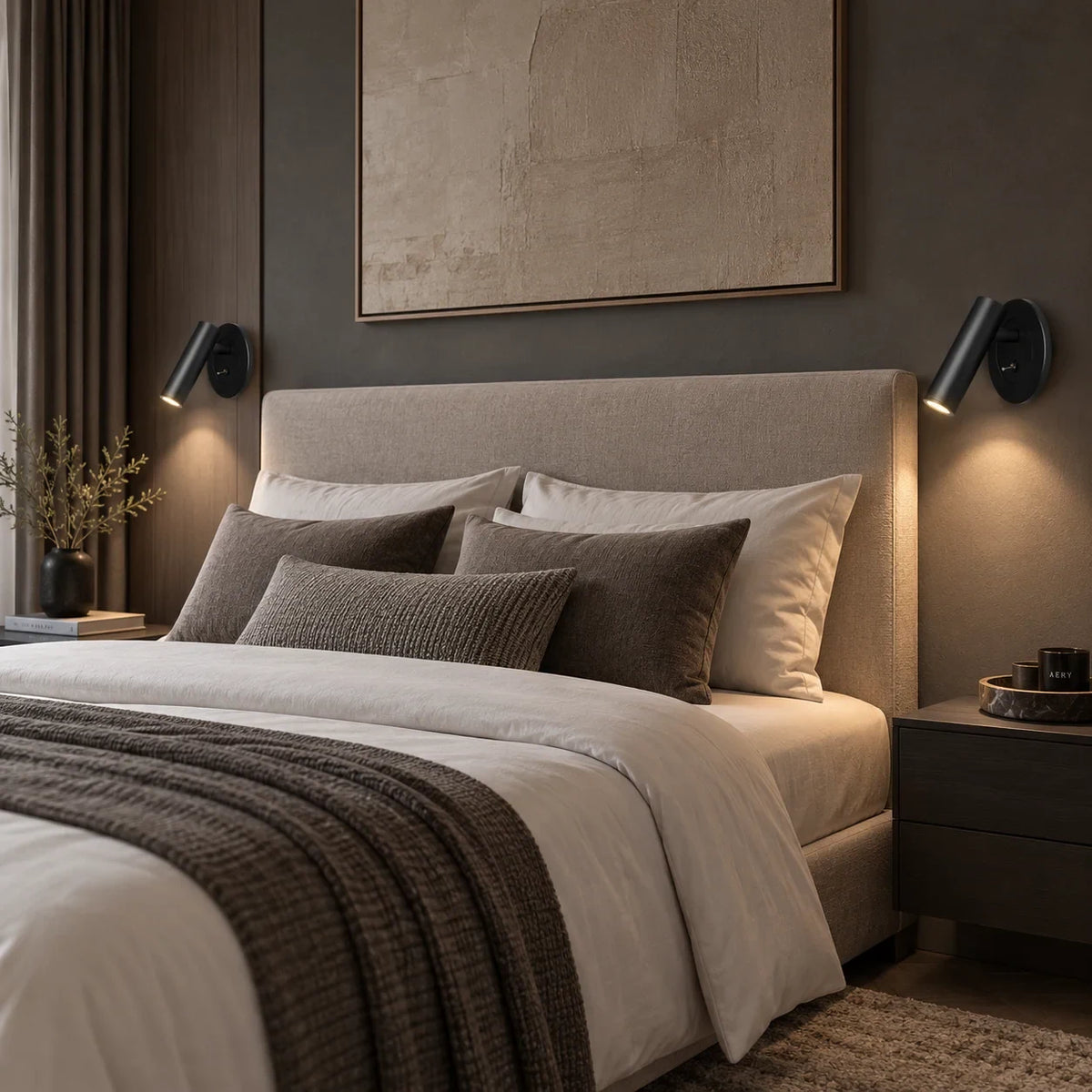 Adjustable reading wall light, a pair in black beside a bed