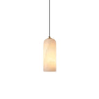 Alabaster cylinder pendant light, lit, on a white background