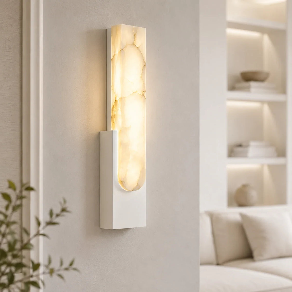 Alabaster panel wall light, in white, lit in a living room