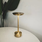 Aluminium cordless table lamp, lit in a room setting