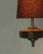 Walnut and antique brass wall light, walnut base detail