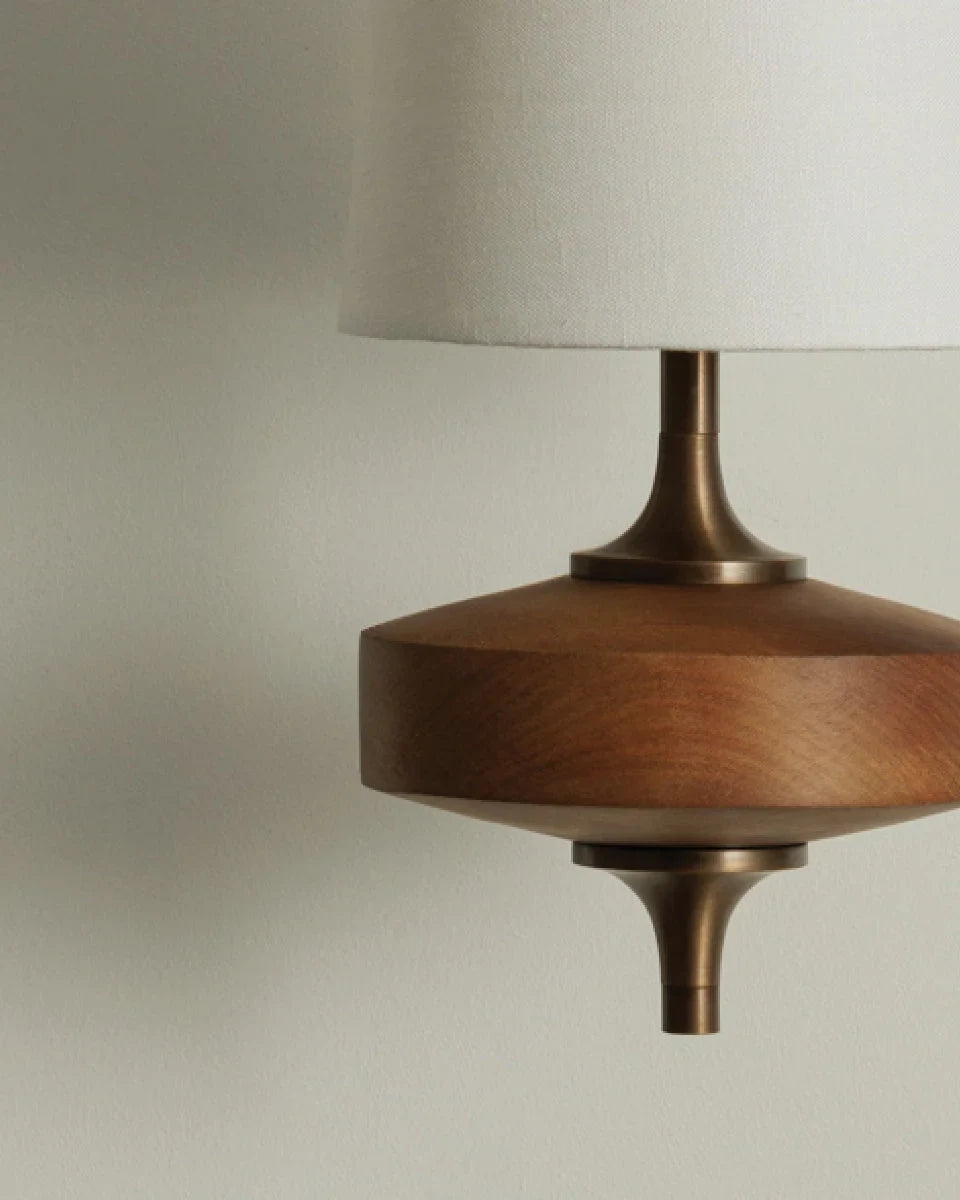 Walnut and antique brass wall light, turned walnut base close-up