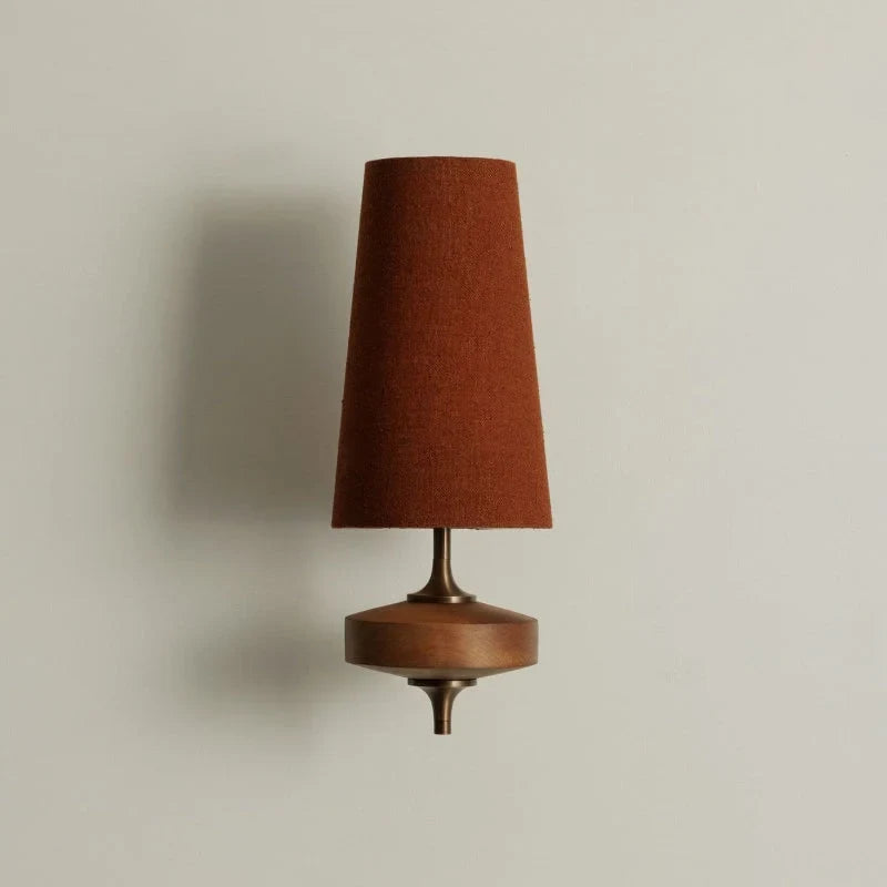 Walnut and antique brass wall light, single, with a red shade