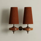 Walnut and antique brass wall light, double, with red shades