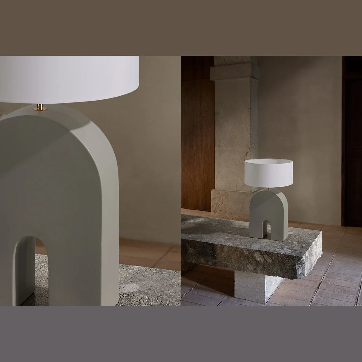 Arched ceramic table lamp base in ash grey, in a living room, with a white shade (shade not included)