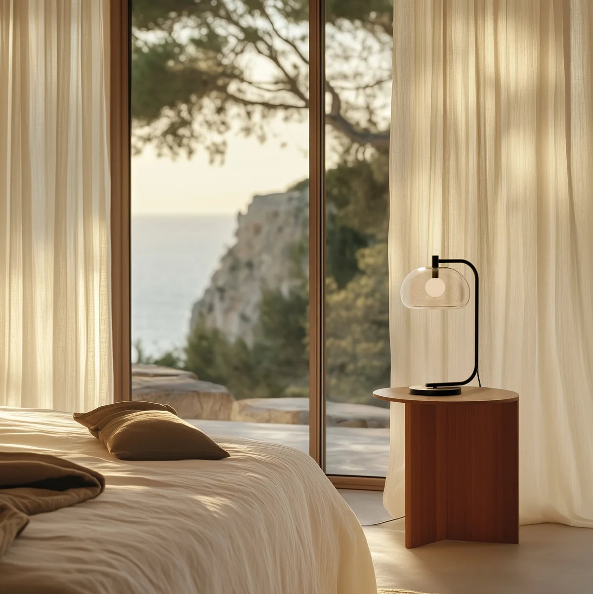 Arched table lamp with domed shade, beside a bed by a window