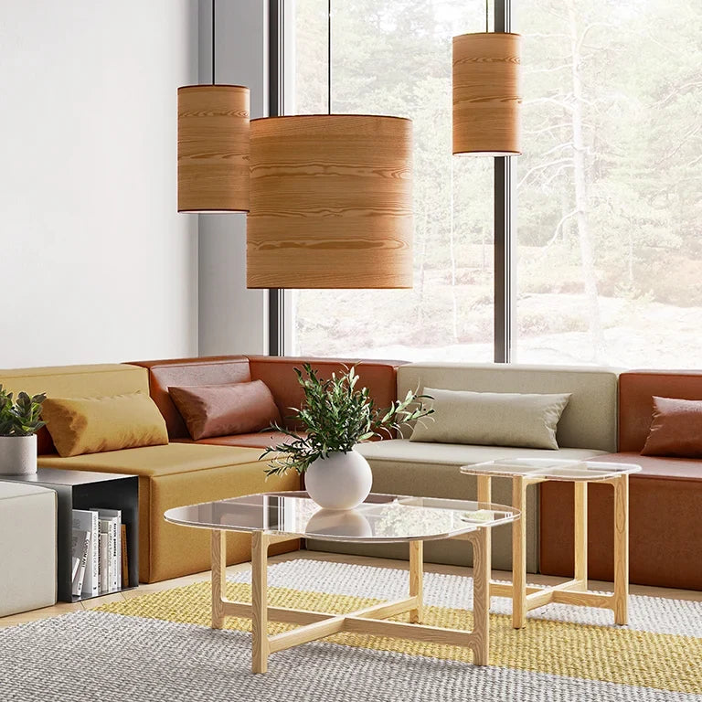 Large ash veneer drum pendant, grouped above a living room