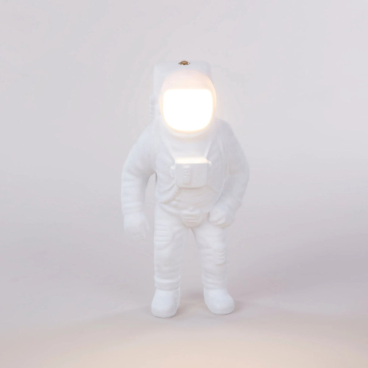 Astronaut cordless table lamp in white resin, lit, front view