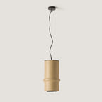 Banded hand-painted ceramic cylinder pendant, in sand on a plain background