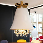 Bell pendant chandelier, in white above a table