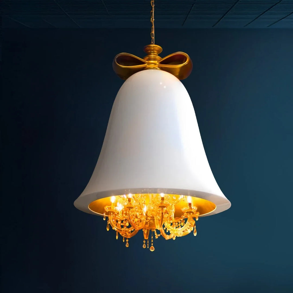 Bell pendant chandelier, in white against a dark blue wall