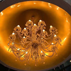 Bell pendant chandelier, lit chandelier inside the bell from below