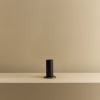 Blackened oak bulb holder table lamp, empty, on a shelf