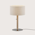 Braided leather column table lamp with drum shade, showing the metallic disc base