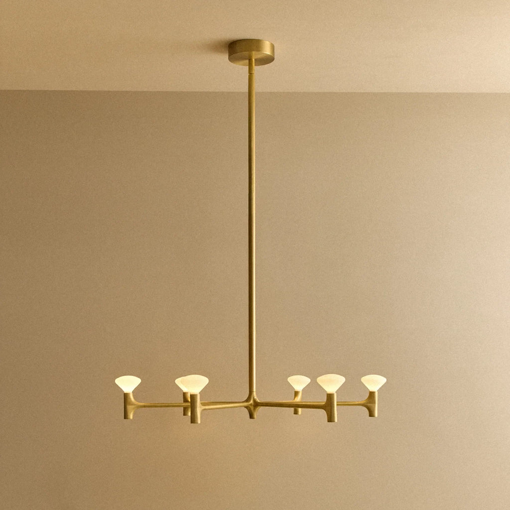 Branching brass chandelier, lit, medium