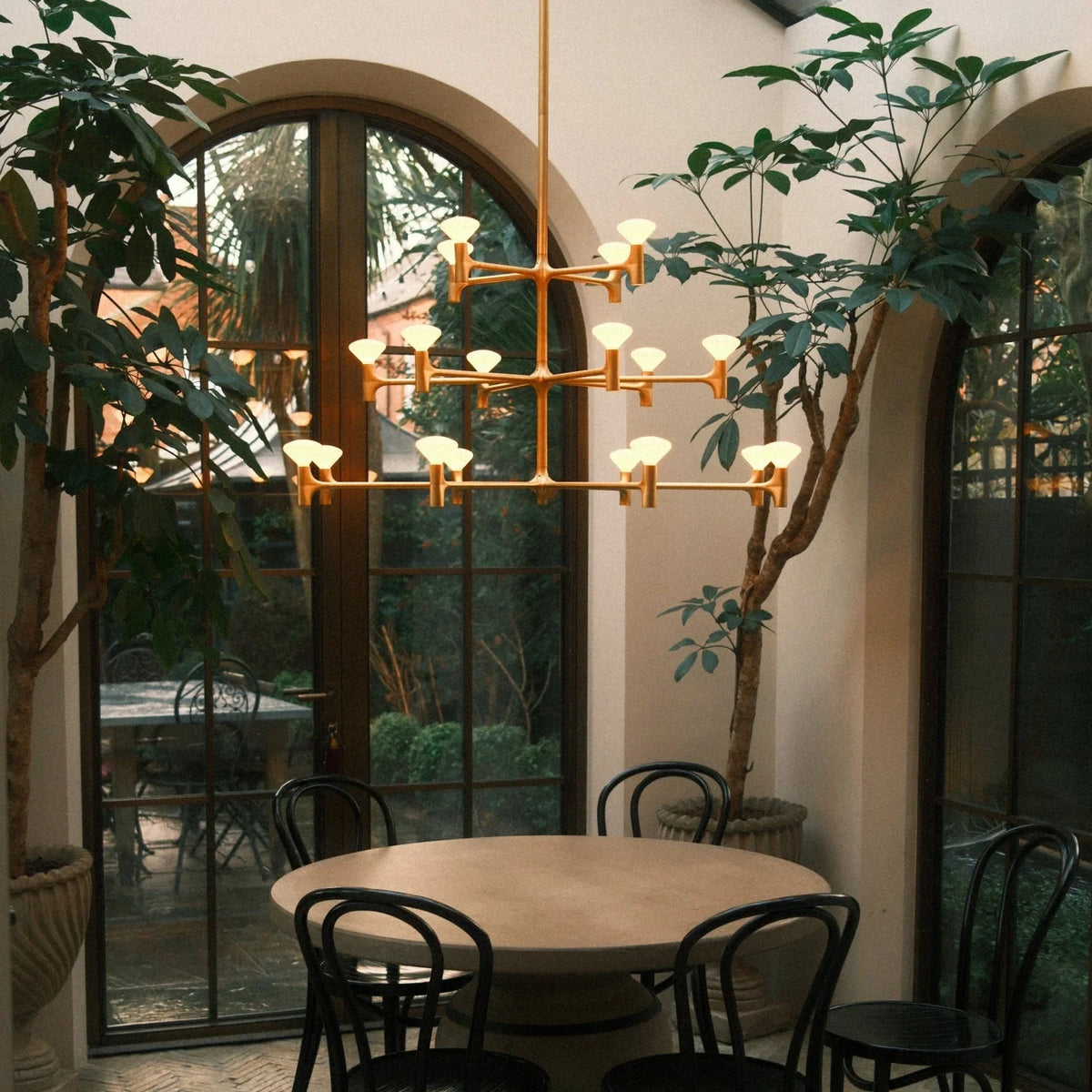 Branching brass chandelier, in a dining room