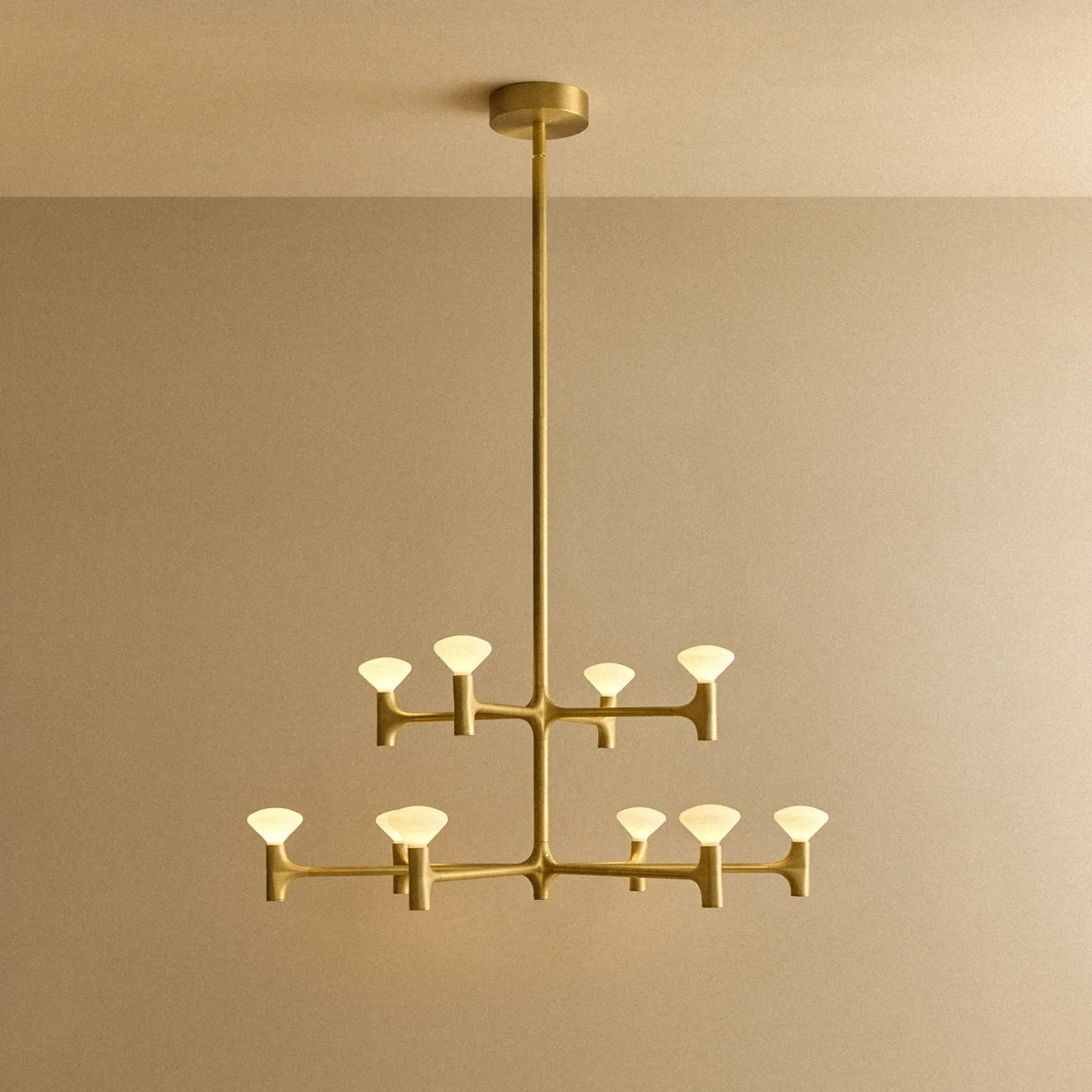 Branching brass chandelier, lit, medium