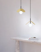 Brass disc globe pendant with fabric cable, black, pendants above a marble console