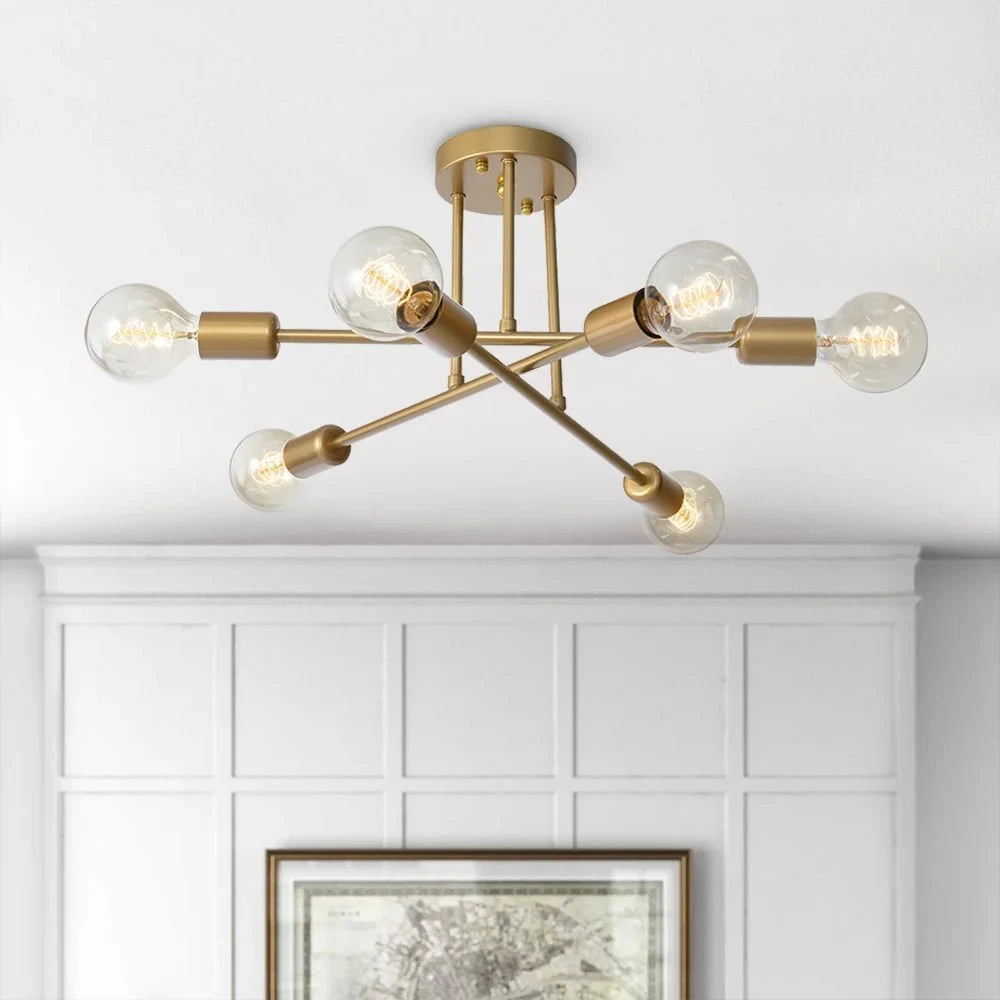 Brass sputnik semi-flush ceiling light, above a panelled wall