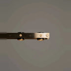 Brass track LED pendant, close-up of the brass bar