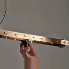 Brass track LED pendant, fitting a spot by hand