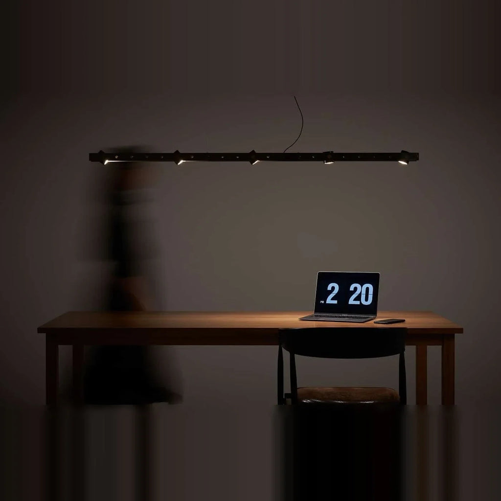 Brass track LED pendant, above a desk