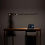 Brass track LED pendant, above a desk