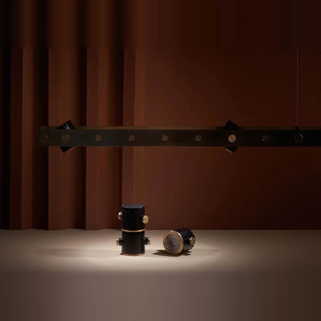 Brass track LED pendant, spots on a table