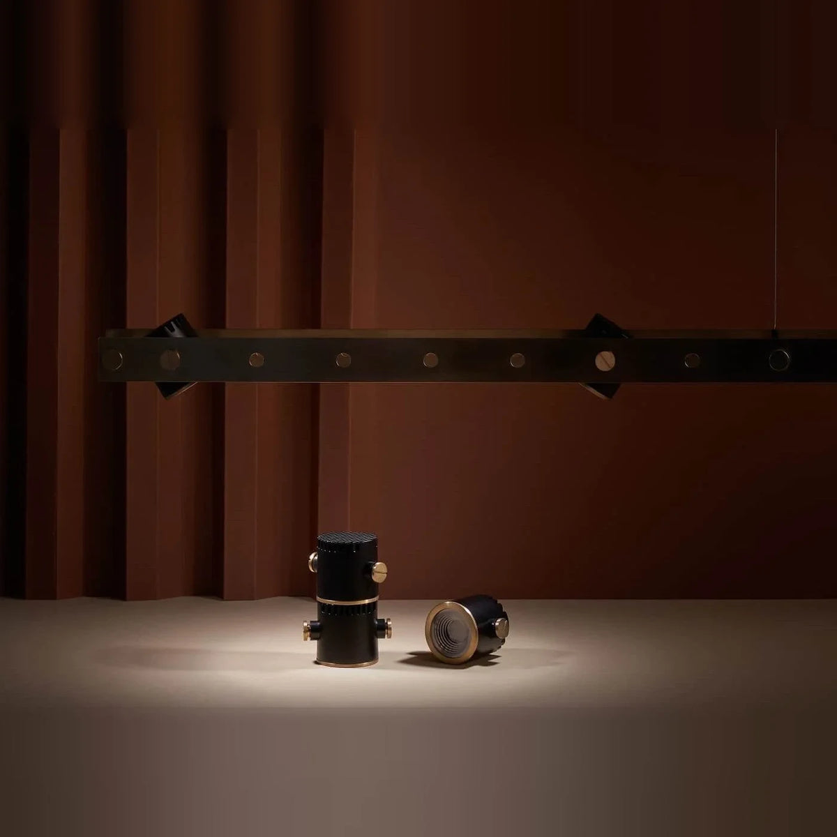 Brass track LED pendant, spots on a table
