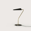 Cantilevered reeded table lamp, with a brass arm and black shade, on a marble base