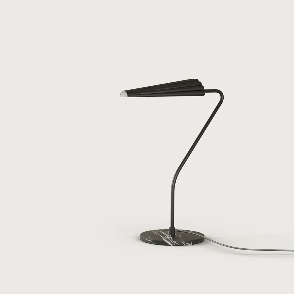 Cantilevered reeded table lamp, with a matte black arm and shade