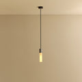 Cast metal hexagonal pendant, on a plain background