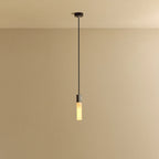 Cast metal hexagonal pendant, on a plain background