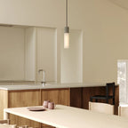 Cast metal hexagonal pendant, above a kitchen island