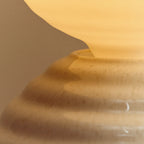 Ceramic wake light lamp pair, close-up of the rippled glaze, lit